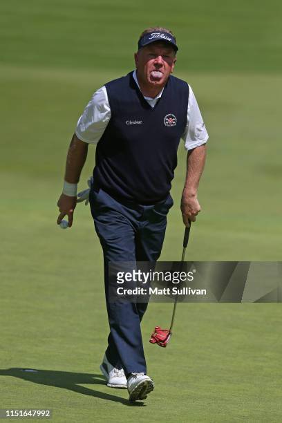 Paul Broadhurst of England reacts to a putt on the 13th hole during the third round of the KitchenAid Senior PGA Championship at Oak Hill Country...