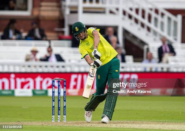 Chris Morris of South Africa hits the ball over the boundary for six during the Group Stage match of the ICC Cricket World Cup 2019 between Pakistan...