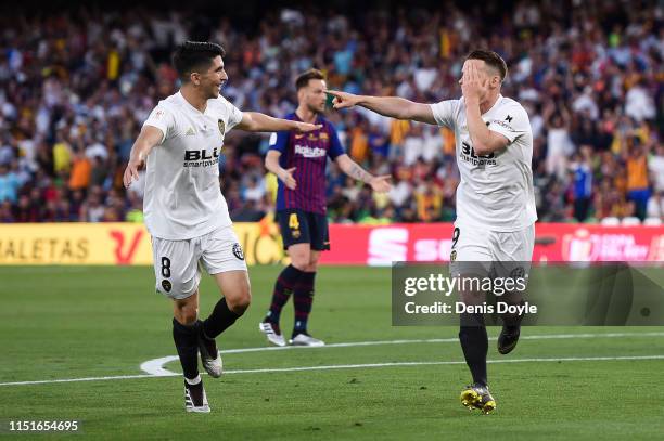 Kevin Gameiro of Valencia CF celebrates with his team mate Carlos Soler after scoring his team's first goal during the Spanish Copa del Rey match...