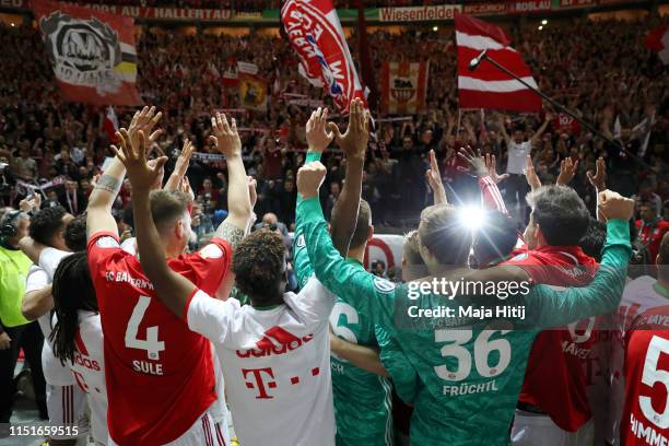 Bayern Munich players shows appreciation to the fans following their victory in the DFB Cup final between RB Leipzig and Bayern Muenchen at...