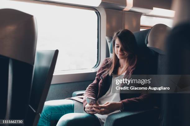 a passenger on tgv train watching her smartphone, paris, france, europe - tgv 個照片及圖片檔