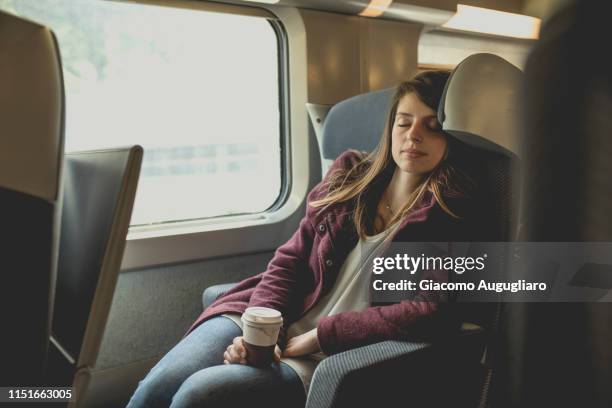 young woman sleeping on tgv train, paris, france, europe - tgv 個照片及圖片檔