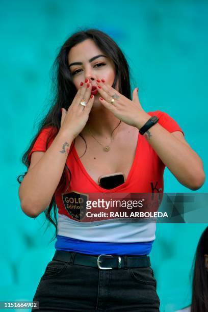Paraguay's model Larissa Riquelme blows a kiss before the start of the Copa America football tournament group match against Colombia at the Fonte...