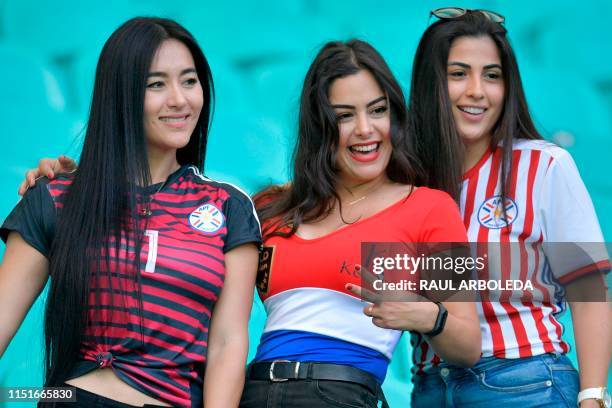 Paraguay's model Larissa Riquelme and other fans pose before the start of the Copa America football tournament group match against Colombia at the...