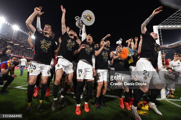 Valencia CF players celebrate with the trophy at the end of the Spanish Copa del Rey match between Barcelona and Valencia at Estadio Benito...