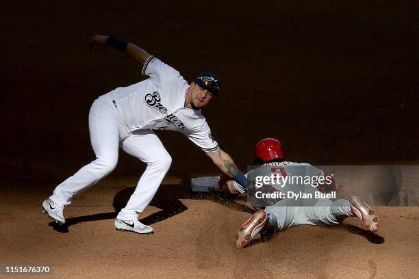 Bryce Harper of the Philadelphia Phillies steals second base past Hernan Perez of the Milwaukee Brewers in the seventh inning at Miller Park on May...