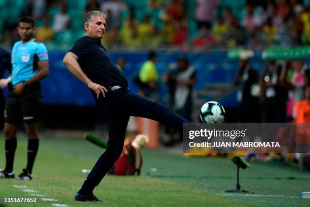 Colombia's coach, Portuguese Carlos Queiroz, stretches for the ball during the Copa America football tournament group match against Paraguay at the...