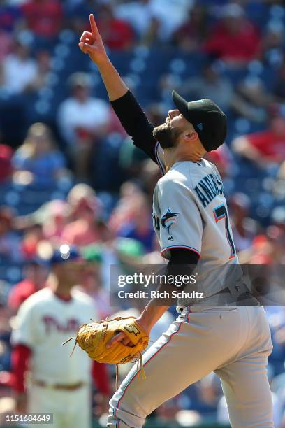 Pitcher Nick Anderson of the Miami Marlins points to the ball popped up to catcher Bryan Holaday by Roman Quinn of the Philadelphia Phillies for the...