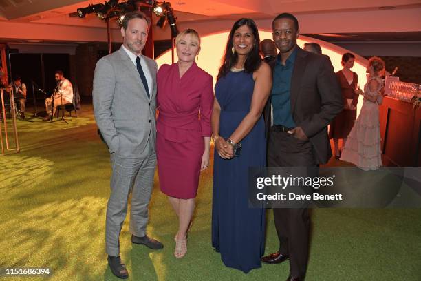 Russell Thomas, Kim Cattrall, Lolita Chakrabarti and Adrian Lester attend the Midsummer Party for The Old Vic at The Brewery on June 23, 2019 in...