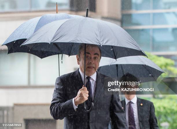 Former Nissan Motor Chairman Carlos Ghosn arrives for a pre-trial hearing at the Tokyo District Court in Tokyo on June 24, 2019. - The former Nissan...