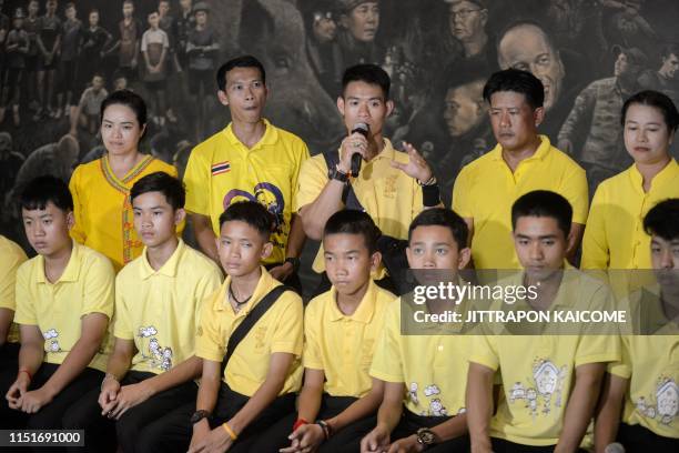 Ekkapol "Coach Ek" Chantawong of the "Wild Boars" football team speaks during an interview at the Tham Luang cave centre as they mark the first...