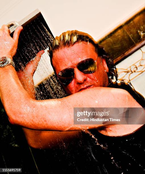 Indian fashion designer Rohit Bal poses during a photoshoot, on June 9, 2007 in New Delhi, India.