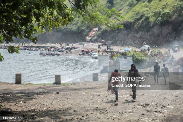 Local walk past the shores of Lake Kivu in Goma. DR Congo is currently experiencing the second worst Ebola outbreak in recorded history. More than...