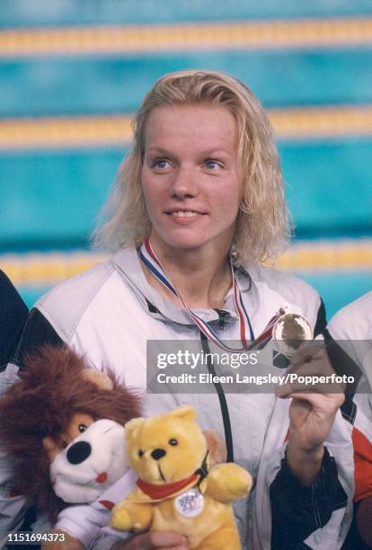 Dagmar Hase representing Germany poses with her gold medal after a freestyle event during the 1993 European Aquatics Championships at the Ponds Forge...