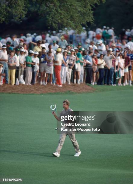 Scottish golfer Sandy Lyle acknowledges the crowd enroute to winning the US Masters Golf Tournament at the Augusta National Golf Club in Georgia on...
