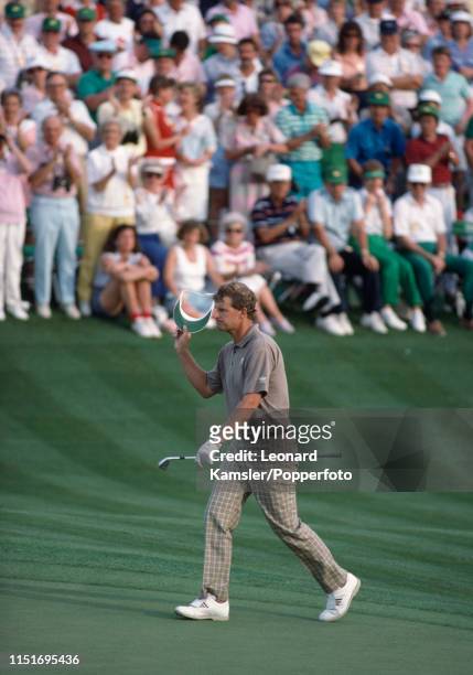 Scottish golfer Sandy Lyle strides up the fairway on the last hole enroute to winning the US Masters Golf Tournament at the Augusta National Golf...