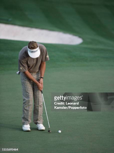 Scottish golfer Sandy Lyle putting on the last hole enroute to winning the US Masters Golf Tournament at the Augusta National Golf Club in Georgia on...