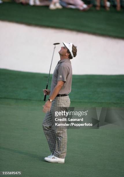 Scottish golfer Sandy Lyle reacts on the last hole enroute to winning the US Masters Golf Tournament at the Augusta National Golf Club in Georgia on...