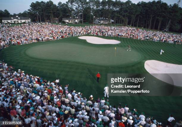 Scottish golfer Sandy Lyle arrives on the last green enroute to winning the US Masters Golf Tournament at the Augusta National Golf Club in Georgia...