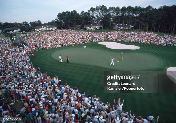 Scottish golfer Sandy Lyle celebrates with his caddy, Dave Musgrove, after winning the US Masters Golf Tournament at the Augusta National Golf Club...