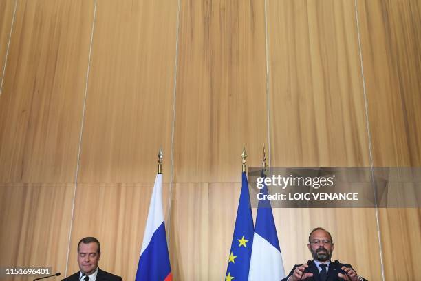 French Prime Minister Edouard Philippe and his Russian counterpart Dmitry Medvedev, take part in a press conference during an official visit to Le...