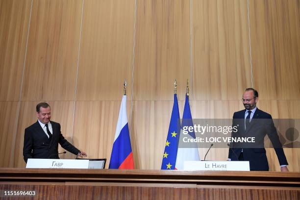 French Prime Minister Edouard Philippe and his Russian counterpart Dmitry Medvedev, take part in a press conference during an official visit to Le...