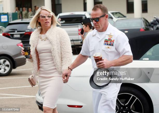 Navy Special Operations Chief Edward Gallagher walks into military court with his wife Andrea Gallagher June 24, 2019 in San Diego, California. Chief...