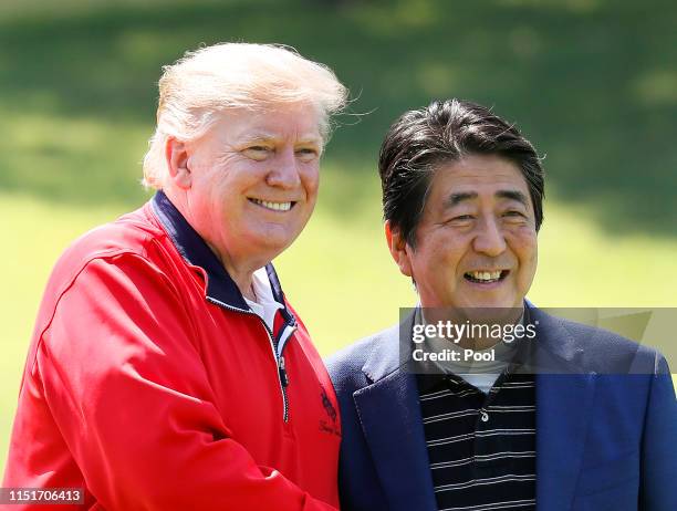 President Donald Trump is welcomed by Japanese Prime Minister Shinzo Abe as he arrives to play golf at Mobara Country Club on May 26, 2019 in Chiba,...
