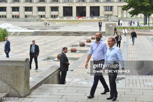 French Prime minister Edouard Philippe and his Russian homolog Dimitri Medvedev walk down during an official visit in Le Havre, western France on...