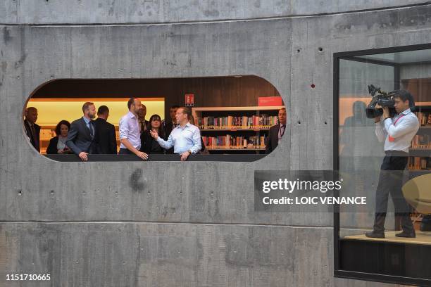 French Prime minister Edouard Philippe and his Russian homolog Dimitri Medvedev visit the Oscar Niemeyer library during an official visit, on June...