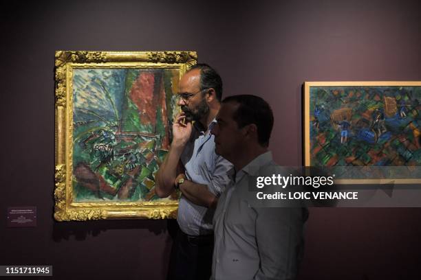 French Prime minister Edouard Philippe and his Russian homolog Dimitri Medvedev visit the Raoul Dufy exhibition at the MuMa Modern Art Museum during...