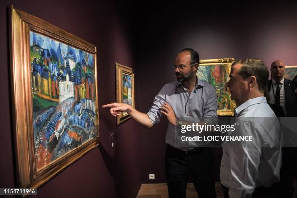 French Prime minister Edouard Philippe and his Russian homolog Dimitri Medvedev visit the Raoul Dufy exhibition at the MuMa Modern Art Museum during...