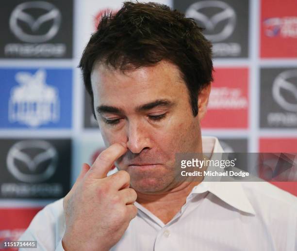 Kangaroos head coach Brad Scott, who coached his last match for the club yesterday against Western Bulldogs, looks emotional when speaking to media...