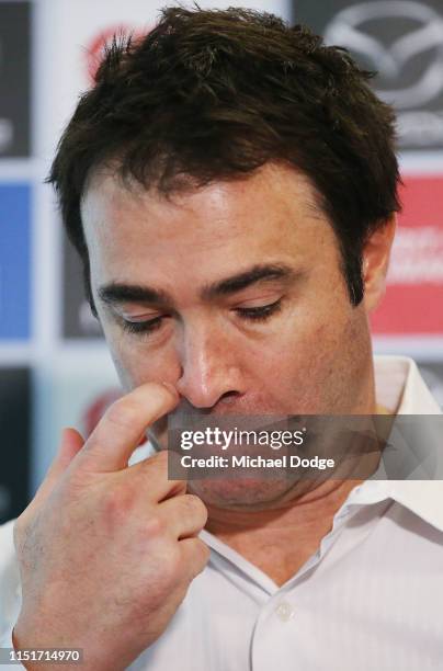 Kangaroos head coach Brad Scott, who coached his last match for the club yesterday against Western Bulldogs, looks emotional when speaking to media...