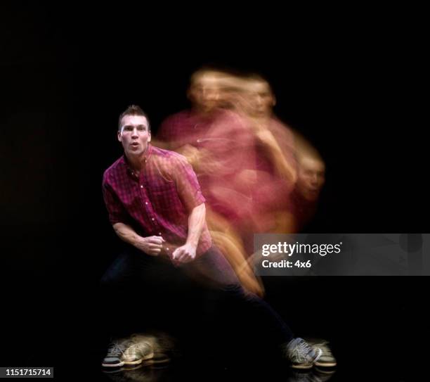 handsome man in motion blur - multiple exposure movement stock pictures, royalty-free photos & images