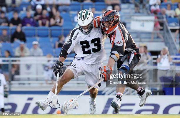 Mike Ward of the Long Island Lizards battles for a loose ball against Kevin Unterstein of the Denver Outlaws during their Major League Lacrosse game...