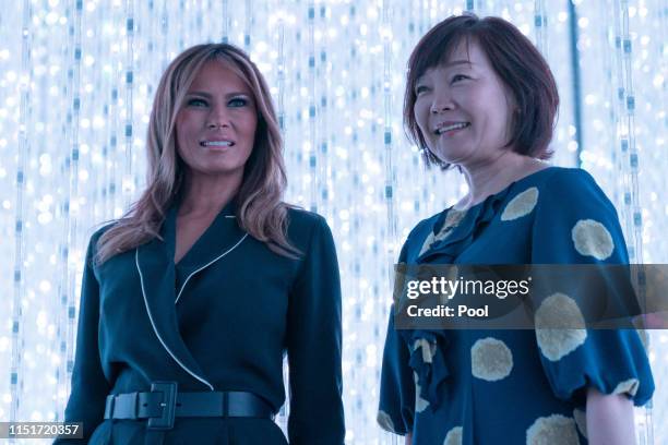 Japan's Prime Minister Shinzo Abe's wife Akie Abe and U.S. First Lady Melania Trump visit the MORI Building DIGITAL ART MUSEUM on May 26, 2019 in...