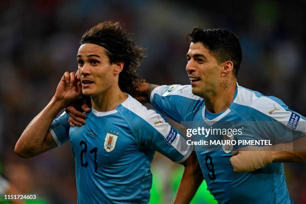 Uruguay's Edinson Cavani celebrates with teammate Luis Suarez after scoring against Chile during their Copa America football tournament group match...