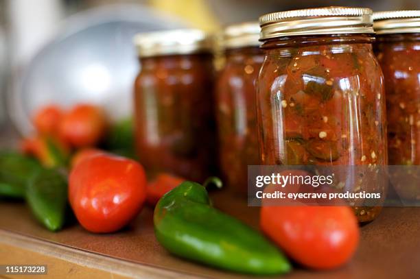 canned spicy mexican salsa - salsa sauce stock pictures, royalty-free photos & images