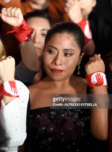 Mexican actress Yalitza Aparicio poses at the red carpet of the 61st edition of the Ariel awards ceremony, at the Cineteca Nacional in Mexico City on...