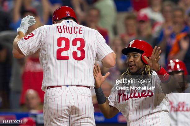 Jay Bruce of the Philadelphia Phillies celebrates with Maikel Franco after hitting a pinch-hit two run home run in the bottom of the sixth inning...