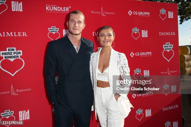 Sophia Thomalla and her boyfriend Loris Karius during the "Ein Herz fuer Kinder" summer party on June 24, 2019 at Wannseeterrassen in Berlin, Germany.