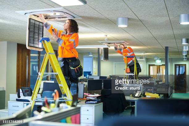 office aircon servicing - building maintenance stock pictures, royalty-free photos & images