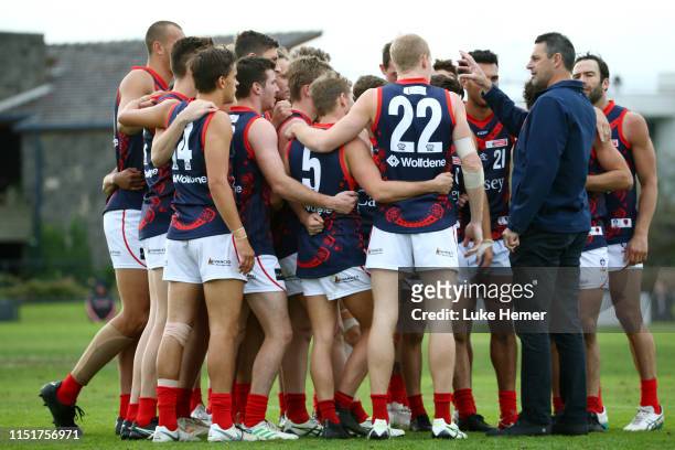 Jade Rawlings coach of Casey talks to his players during the round eight VFL match between Williamstown and Casey on May 26, 2019 in Melbourne,...