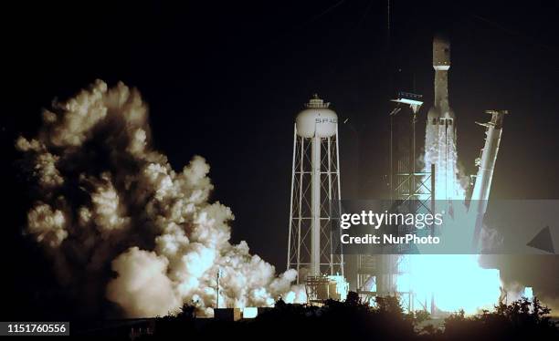 Kennedy Space Center, Florida, United States - A SpaceX Falcon Heavy rocket carrying satellites for the U.S. Air Force successfully launches from pad...