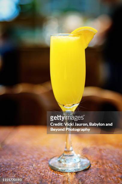 bright yellow lemon cocktail served at brunch on long island - champagne brunch stock pictures, royalty-free photos & images