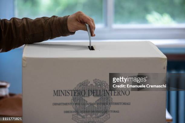 Man casts his vote during the European Parliamentary election at a polling station on May 26, 2019 in Milan, Italy. More than 430 million people all...