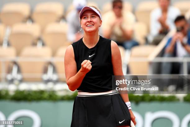 Anastasia Potapova of Russia celebrates in her ladies singles first round match against Angelique Kerber of Germany during Day one of the 2019 French...