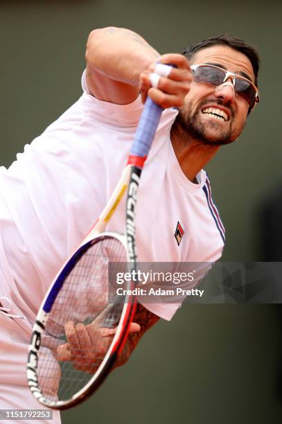 Janko Tipsarevic of Serbia serves during his mens singles first round match against Grigor Dimitrov of Bulgaria during Day one of the 2019 French...