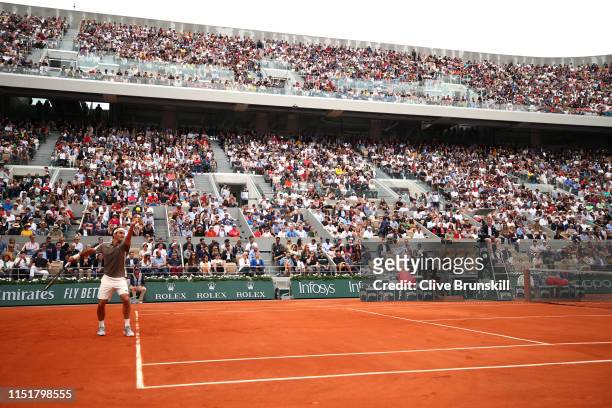 General view as Roger Federer of Switzerland serves during his mens singles first round match against Lorenzo Sonego of Italy during Day one of the...